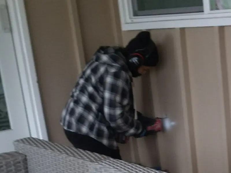 Professional electrician installing an exterior outlet in Indianapolis
